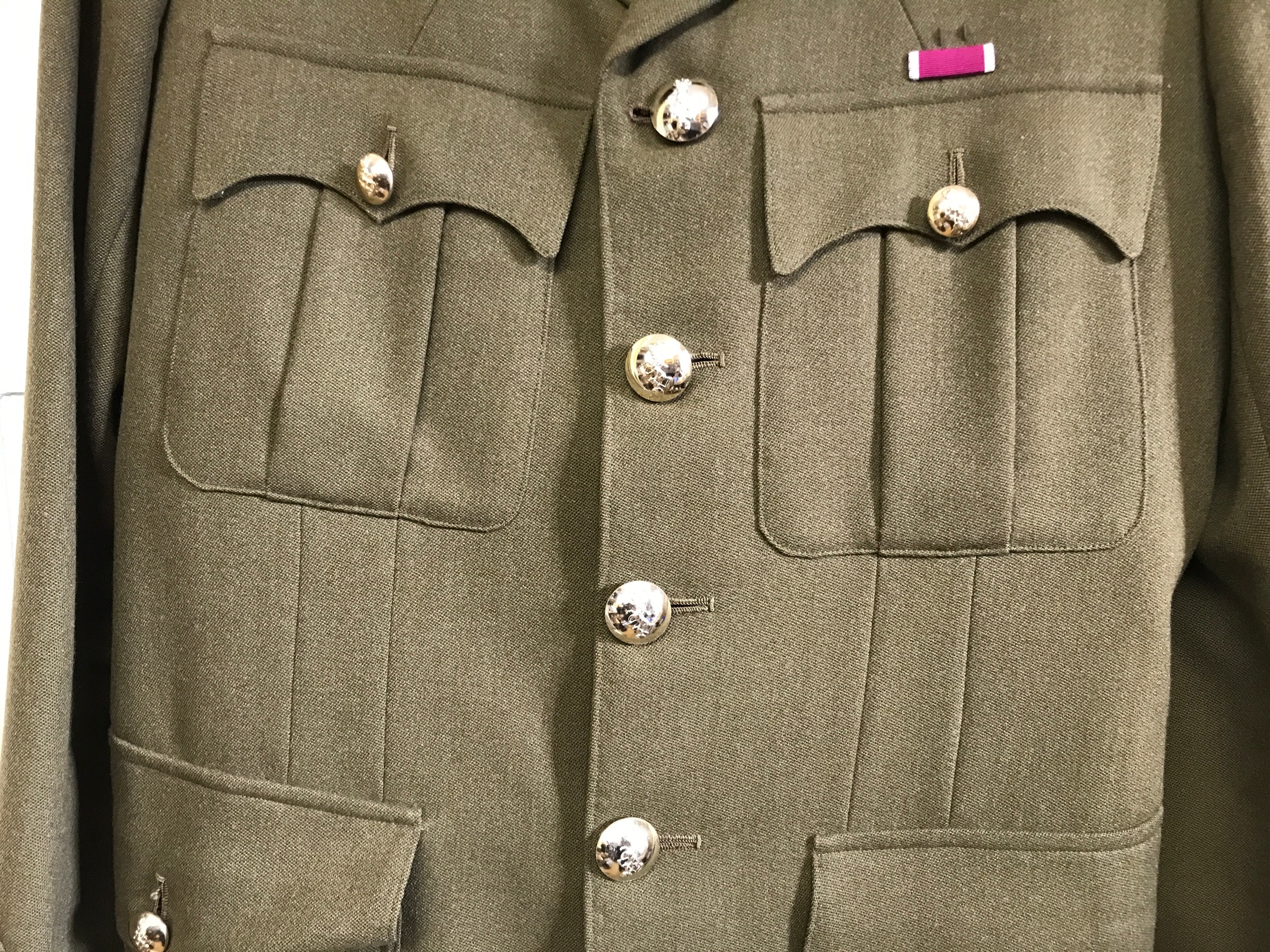 A British military uniform bearing the insignia of the Royal Electrical and Mechanical Engineers. - Image 4 of 6