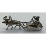 Silver sleigh, pulled by a reindeer, import marks for Chester 1899. 28gms. 8cms l.Condition