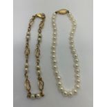 Two bracelets, one cultured pearl with clasp marked 14k and a 9ct gold and pearl.