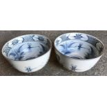 A pair of blue and white pottery bowls with dragonfly and foliage decoration. 26cm w x 15.5cms h.