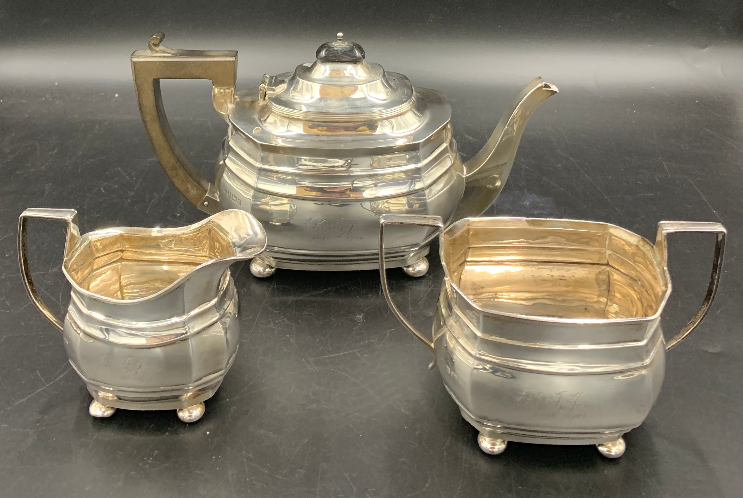 Three piece silver tea service inscribed to front. Birmingham 1915, 1917 maker George Nathan and