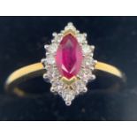 An 18ct gold ruby and diamond cluster ring. Size R. Total weight 4gms.Condition ReportGood