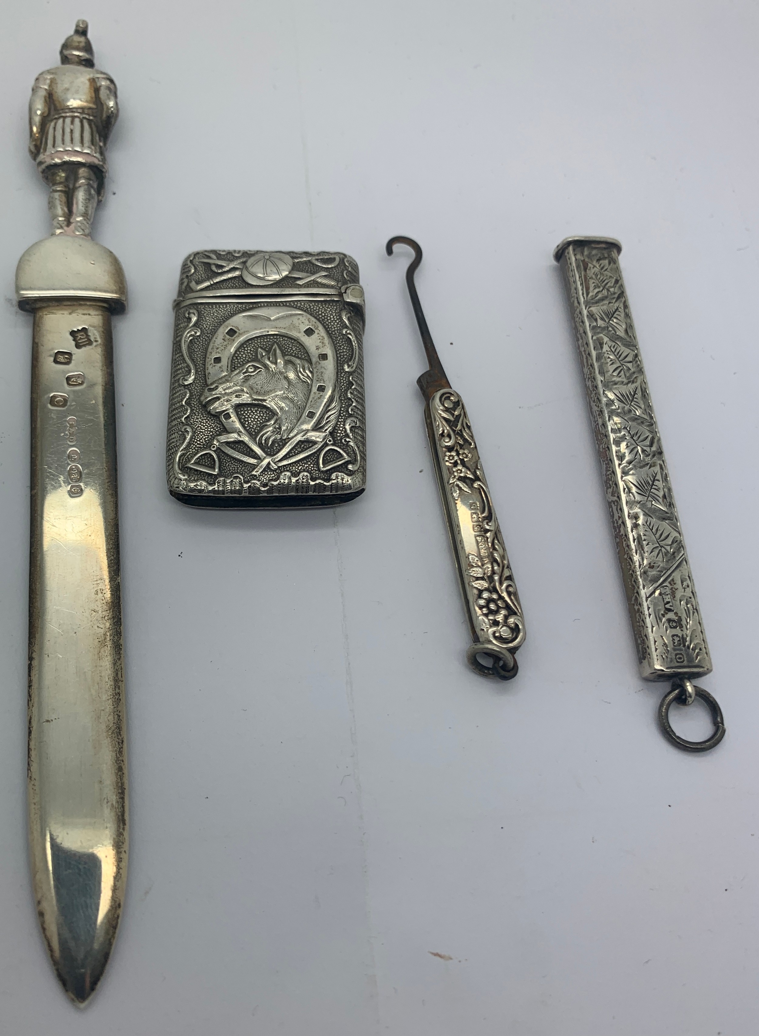 Four various silver and white metal items to include a paperknife, a button hook Birmingham 1901, - Image 2 of 4