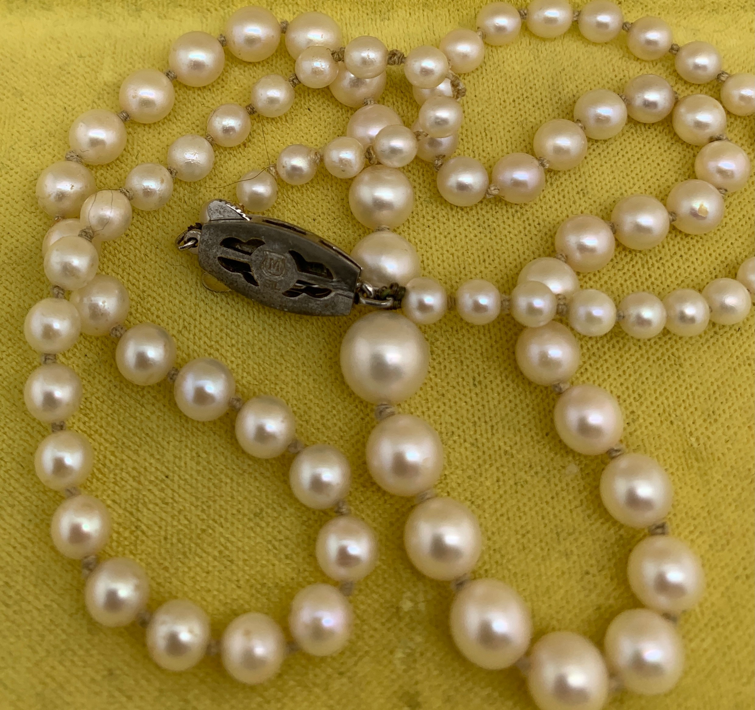 A Mikimoto single strand necklace of graduated pearls with a white metal clasp. 52cms l.Condition - Image 4 of 4