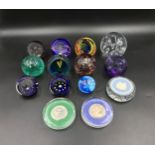 A collection of 14 paperweight of various colour and design to include Caithness, Wedgwood,