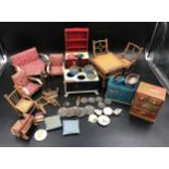 Dolls house furniture selection, tinplate dresser, stove and cupboard, fireside tools, fire front,