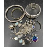 A quantity of white metal and silver jewellery to include bangle, pendant, earrings etc.Condition