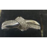 A 9ct white gold ring set with diamonds, Size N, Weight 1.9gms, together with 3 pairs of pierced