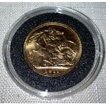George V 1911 full Gold Sovereign in capsule.Condition ReportVF.