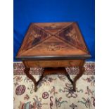 A GOOD QUALITY ROSEWOOD & INVORY INLAID ENVELOPE CARD TABLE, the top folds out to reveal a tooled