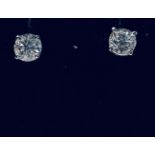 A CLASSIC PAIR OF 18CT WHITE GOLD DIAMOND STUD EARRINGS, 1.07cts diamond, G colour, each fitted with