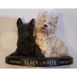 A 20TH CENTURY BLACK & WHITE WHISKY PUB ADVERT, ornament in the form of two scotty dogs, 20.3cm (