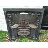 A 19TH CENTURY CAST IRON FIRE INSERT/SURROUND, with floral motif, 3ft wide x 38 inches tall approx.