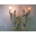 A LARGE RARE PAIR OF 19TH CENTURY PLASTER GREEK STYLE FIGURES, on stands, each holding a light