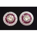 A GLAMOUROUS PAIR OF 18CT WHITE GOLD ART DECO INSPIRED RUBY & DIAMOND TARGET STUD EARRINGS, with a