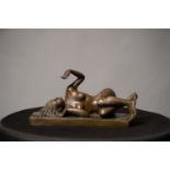 A 20TH CENTURY BRONZE OF RECLINGING YOUNG WOMAN, signed milo, 9 ½in long x 5 1/2in high