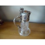 A GOOD QUALITY CUT GLASS CLARET JUG, with cut glass boy, silver plated handle, collar and lid having