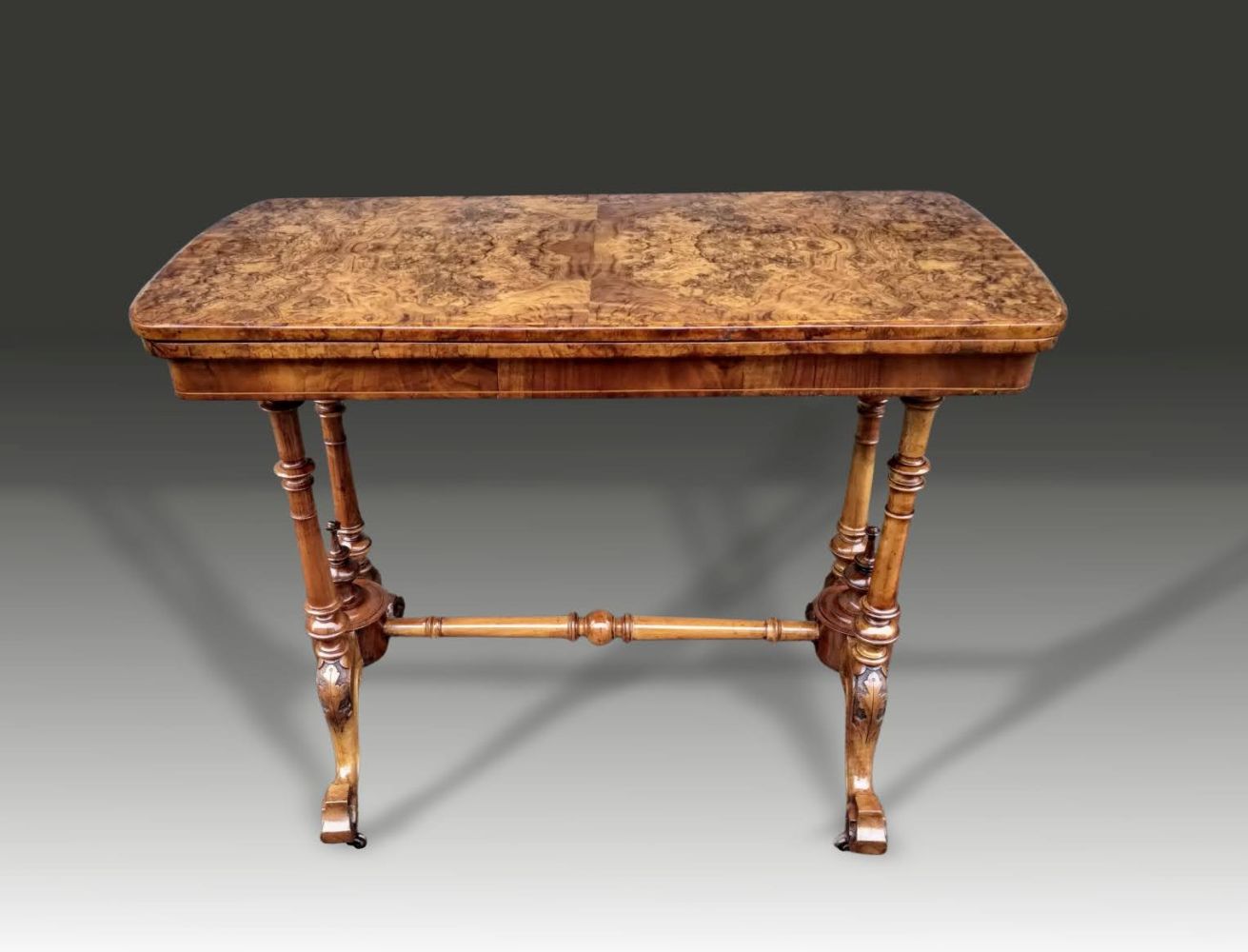 A GOOD QUALITY VICTORIAN WALNUT CARD TABLE, raised on stretcher base with four turned columns - Image 2 of 3