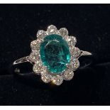 AN 18CT WHITE GOLD COLOMBIAN EMERALD & DIAMOND CLUSTER RING, the Emerald is 2.55cts, surrounded by