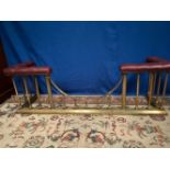 A GOOD QUALITY BRASS CLUB FENDER, with buttoned leather seats, 167cm x 47cm x 54cm (H) approx.