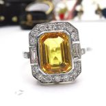 A STUNNING VINTAGE PLATINUM YELLOW CUSHION CUT SAPPHIRE & DIAMOND RING, the beautiful piece features