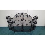 A LARGE METAL 3 PANEL FIRE SCREEN, with narrow mesh, each panel decorated with floral display, an