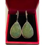 A PAIR OF 18CT WHITE GOLD JADEITE JADE & DIAMOND PENDANT EARRINGS, the pear shaped carved jadeite