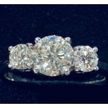 AN EXQUISITE & TIMELESS 18CT WHITE GOLD THREE STONE DIAMOND RING, diamond weight 1.52cts, the centre