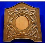 A RARE EARLY 20TH CENTURY IRISH ARTS & CRAFTS COPPER PICTURE FRAME, the shaped frame is decorated