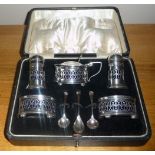 A CASED SILVER CONDIMENT SET, with velvet lined interior, comprising of 2 x pepperettes, a mustard