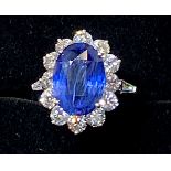 A STUNNING 18CT WHITE GOLD CEYLON SAPPHIRE & DIAMOND CLUSTER RING, with tapered baguette cut