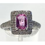 AN 18CT WHITE GOLD PINK SAPPHIRE & DIAMOND CLUSTER RING, the exquisite pink Sapphire is of very high
