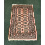 A PAKISTAN BOKHARA RUG, Lahore Pakistan, hand woven, knot density of 400,000 knots per sq. m., 1.46m