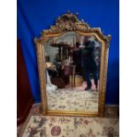 A GILT MIRROR HAVING BEVEALED GLASS, 99cm x 148cm (H) approx.