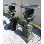 A PAIR OF LARGE CAST IRON URNS