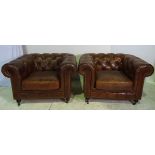 A PAIR OF GOOD QUALITY CHESTERFIELD STYLE LEATHER ARMCHAIRS, with deep buttoned back and armrests,
