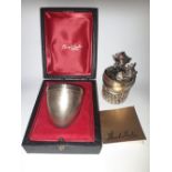 A CASED LIMITED EDITION STUART DEVLIN SILVER NOVELTY EGG, depicting a rabbit hatching from a