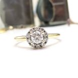 A 14CT YELLOW GOLD VINTAGE DIAMOND HALO RING, size O and a half, with a larger central diamond