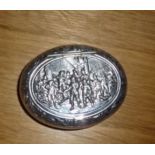 A SILVER SNUFF BOX, with hinged lid, decorated with imagery of a battle scene possible from the