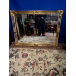 A GILT OVER MANTLE MIRROR, 118cm x 89cm approx.