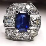 A STUNNING STATEMENT SAPPHIRE & DIAMOND RING, set in Platinum, with natural emerald cut sapphire