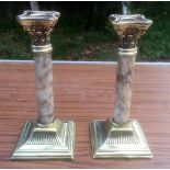 A PAIR OF EARLY 20TH CENTURY BRASS & MARBLE CANDLESTICKS, 19cm (H) approx.