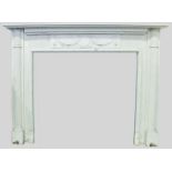 AN 18TH CENTURY PINE & GESSO FIRE SURROUND, with columns on either side, with floral & ribbon