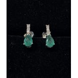 A STUNNING PAIR OF 14CT WHITE GOLD EMERALD & DIAMOND DROP EARRINGS, with a pear shaped Columbian