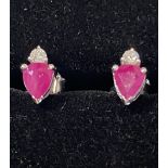 A PAIR OF 14CT RUBY & DIAMOND STUD EARRINGS, with a pear shaped ruby complemented by a brilliant cut