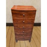 A 20TH CENTURY 6 DRAWER TALL BOY, raised on splayed feet, with tu