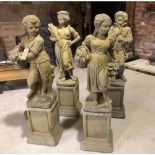 A SET OF FOUR GARDEN PILLAR ORNAMENTS IN THE FORM OF THE FOUR SEA