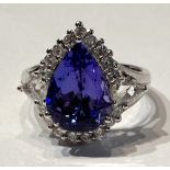 AN EXCEPTIONAL 18CT WHITE GOLD PEAR SHAPED TANZANITE RING, the 5.
