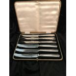 A SET OF 6 SILVER HANDLED BUTTER KNIVES, with stainless steel bla