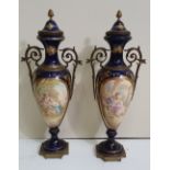 A PAIR OF 19TH CENTURY PORCELAIN URNS in the Sevres style, excell